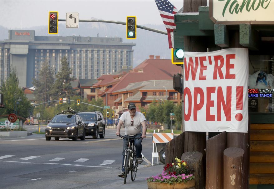 Traffic flows along Highway 50 near Stateline, Nev., as residents begin to return to South Lake Tahoe, Calif., on Sunday, Sept. 5, 2021. Cal Fire officials downgraded some evacuation orders near Lake Tahoe and allowed thousands of South Lake Tahoe residents who fled the Caldor Fire last week to return home Sunday. (Jane Tyska/Bay Area News Group via AP)