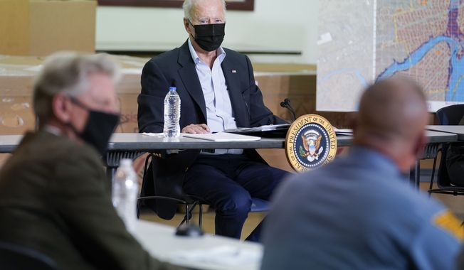 President Joe Biden listens during a briefing about the impact of Hurricane Ida, Tuesday, Sept. 7, 2021, in Hillsborough Township, N.J. (AP Photo/Evan Vucci)