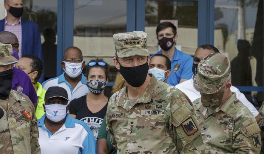In this file photo, U.S. Army Gen. Daniel R. Hokanson, a member of the Chief of Staff, inspects the National Guard operations at the Dryades YMCA, Drive-Thru and walk-up supply Distribution site in New Orleans, La. Tuesday, Sept. 7, 2021. Gen. Hokanson has tested positive for COVID-19. (David Grunfeld, NOLA.com/The Times-Picayune/The New Orleans Advocate via AP) **FILE**
