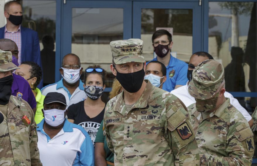 In this file photo, U.S. Army Gen. Daniel R. Hokanson, a member of the Chief of Staff, inspects the National Guard operations at the Dryades YMCA, Drive-Thru and walk-up supply Distribution site in New Orleans, La. Tuesday, Sept. 7, 2021. Gen. Hokanson has tested positive for COVID-19. (David Grunfeld, NOLA.com/The Times-Picayune/The New Orleans Advocate via AP) **FILE**