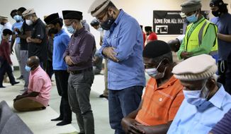 Mansoor Shams (center) and other community members attend Friday prayer on Aug. 13, 2021, in Rosedale, Md. (AP Photo/Jessie Wardarski) **FILE**