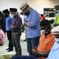 Mansoor Shams (center) and other community members attend Friday prayer on Aug. 13, 2021, in Rosedale, Md. (AP Photo/Jessie Wardarski) **FILE**