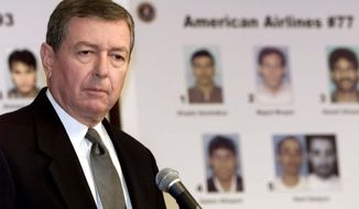FILE - In this Thursday, Sept. 27, 2001 file photo, U.S. Attorney General John Ashcroft meets with reporters at FBI headquarters in Washington, where he released photographs of the 19 suspected hijackers. In the wake of 9/11, he was the administration&#39;s prime advocate of the USA PATRIOT Act, which gave the government broad powers to investigate and prosecute those suspected of terrorism. (AP Photo/Joe Marquette, File)