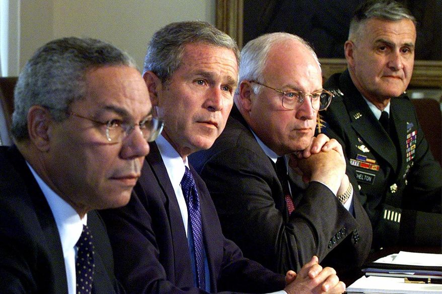 FILE - In this Wednesday, Sept. 12, 2001 file photo, from left, Secretary of State Colin Powell, President George W. Bush, Vice President Dick Cheney and Chairman of the Joint Chiefs of Staff Gen. Henry Shelton attend a meeting with the National Security Council in the Cabinet Room of the White House. While the Secret Service played “hide the president” with Bush on Sept. 11 — he was shuttled to military bases in Louisiana and Nebraska, for fear of terrorist attacks — his vice president hunkered down in a “secure, undisclosed location,” a bunker inside the White House where he helped direct the government’s actions. (AP Photo/Doug Mills, File)