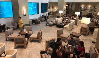 In this Aug. 7, 2019 file photo the interior of the Alohilani Resort is shown in Honolulu. A resort in the famed tourist mecca of Waikiki will be the first in Hawaii to require proof of COVID-19 vaccination for all employees and guests. Starting October 15, &#39;Alohilani Resort will require its employees, patrons and guests to show proof they&#39;re fully vaccinated. (AP Photo/Caleb Jones, File)