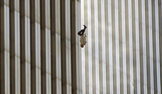 A person falls from the north tower of New York&#x27;s World Trade Center Tuesday, Sept. 11, 2001, after terrorists crashed two hijacked airliners into the World Trade Center and brought down the twin 110-story towers. Associated Press photographer Richard Drew talks about AP’s coverage of 9/11 and the events that followed. (AP Photo/Richard Drew) ** FILE **