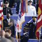 Secretary of Defense Lloyd Austin, front left, accompanied by Joint Chiefs Chairman Gen. Mark Milley, right, participates in an observance ceremony at the Pentagon in Washington, Saturday, Sept. 11, 2021, on the morning of the 20th anniversary of the terrorist attacks. (AP Photo/Alex Brandon)
