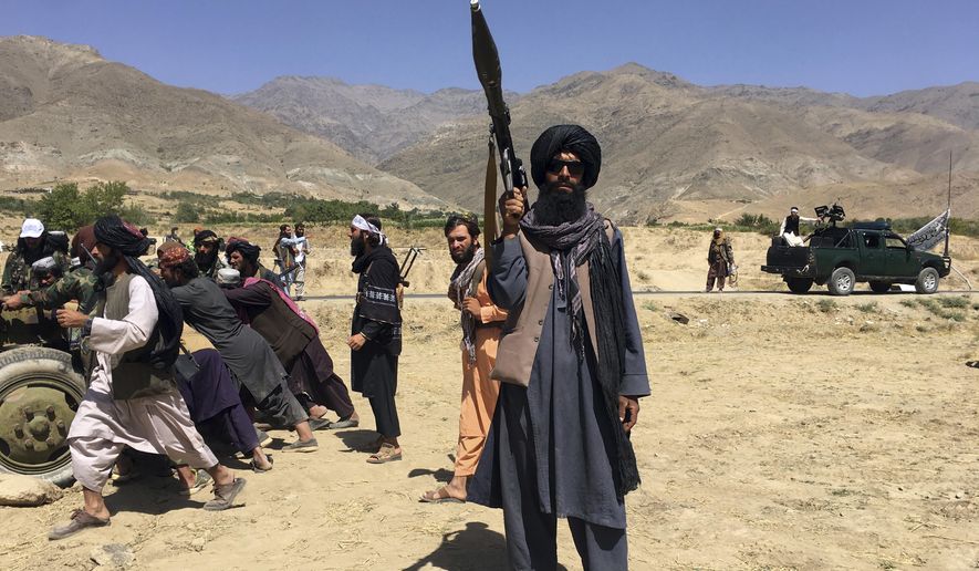 Taliban soldiers stand guard in Panjshir province northeastern of Afghanistan, Wednesday, Sept. 8, 2021. (AP Photo/Mohammad Asif Khan)