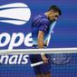 Novak Djokovic, of Serbia, wipes sweat from his face between serves from Daniil Medvedev, of Russia, during the men&#39;s singles final of the US Open tennis championships, Sunday, Sept. 12, 2021, in New York. (AP Photo/Elise Amendola)