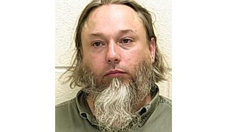 This undated file photo provided by The Ford County Sheriff&#39;s Office in Paxton, Ill., shows Michael Hari, a militia leader convicted of master­minding the bombing of a Minnesota mosque, Hari is now known by her transgender identity, Emily Claire Hari. (Ford County Sheriff&#39;s Office via AP File)