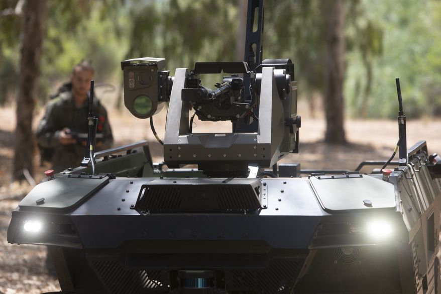 Israel Aerospace Industries' semi-autonomous four-wheel-drive "REX MKII" is seen at an IAI facility near the central Israeli city of Lod, Thursday, Sept. 9, 2021. Israel's state-owned Israel Aerospace Industries unveiled Monday a state-of-the-art unmanned vehicle their specialists said will be deployed alongside ground troops to assist in combat situations. (AP Photo/Sebastian Scheiner)