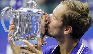 Daniil Medvedev, of Russia, kisses the championship trophy after defeating Novak Djokovic, of Serbia, in the men&#39;s singles final of the US Open tennis championships, Sunday, Sept. 12, 2021, in New York. (AP Photo/John Minchillo) **FILE**
