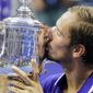 Daniil Medvedev, of Russia, kisses the championship trophy after defeating Novak Djokovic, of Serbia, in the men&#39;s singles final of the US Open tennis championships, Sunday, Sept. 12, 2021, in New York. (AP Photo/John Minchillo) **FILE**