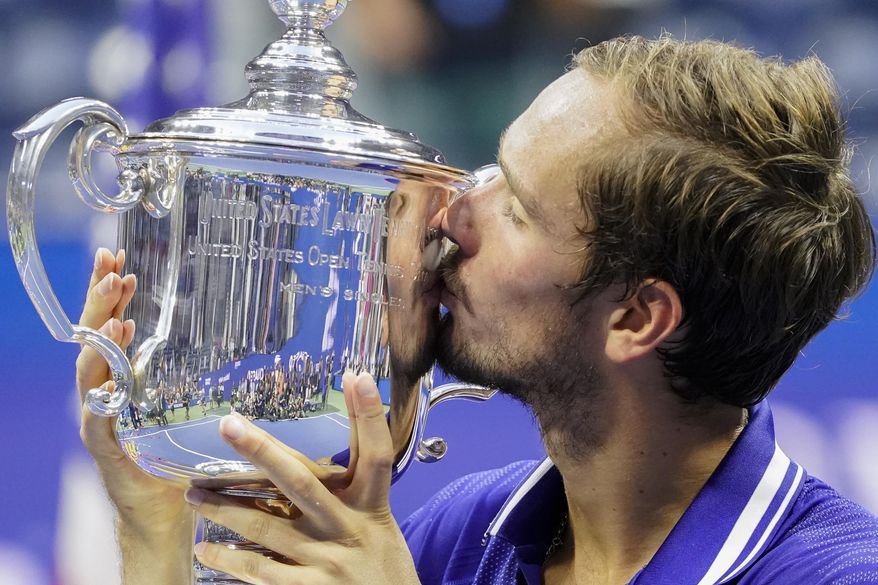 Daniil Medvedev, of Russia, kisses the championship trophy after defeating Novak Djokovic, of Serbia, in the men&#x27;s singles final of the US Open tennis championships, Sunday, Sept. 12, 2021, in New York. (AP Photo/John Minchillo) **FILE**