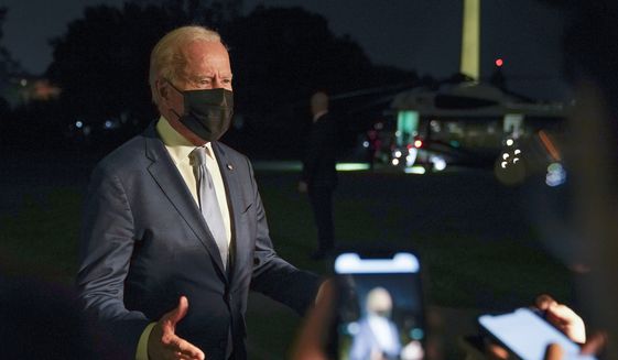 President Joe Biden speaks with members of the press on the South Lawn of the White House after stepping off Marine One, Tuesday, Sept. 14, 2021, in Washington. Biden is returning to Washington after traveling to Idaho, California and Colorado. (AP Photo/Patrick Semansky)