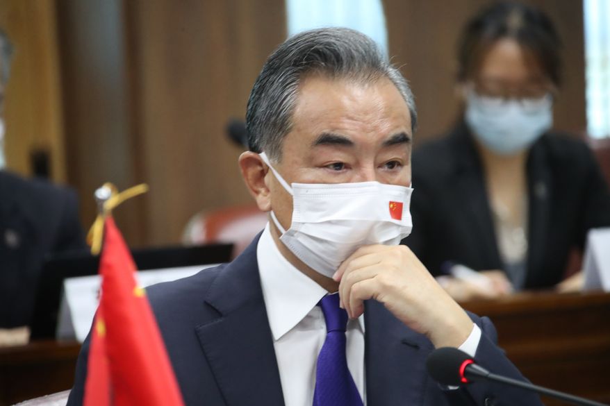 Chinese Foreign Minister Wang Yi attends a meeting with his South Korean counterpart Chung Eui-yong at Foreign Ministry in Seoul, South Korea, Wednesday, Sept. 15, 2021. The foreign ministers met Wednesday for talks expected to focus on North Korea and other regional security issues, two days after North Korea claimed to have tested a newly developed cruise missile. (Kim Seung-doo/Yonhap via AP)