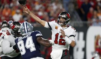 Tampa Bay Buccaneers quarterback Tom Brady (12) fires a pass against the Dallas Cowboys during the first half of an NFL football game Thursday, Sept. 9, 2021, in Tampa, Fla. (AP Photo/Scott Audette)