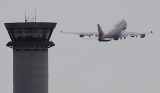 In this Saturday, Oct. 7, 2017 file photo, an aircraft takes off from Larnaca airport past the control tower, at the southern coastal city of Larnaca, Cyprus. A flight safety organization is warning that a Turkish drone base in ethnically divided Cyprus could increase safety risks for thousands of commercial flights that cross the airspace around the eastern Mediterranean island. FSF-Med, which is affiliated with the International Flight Safety Foundation, said Tuesday, Sept. 14, 2021 the planned upgrade for the Turkish air base in Gecitkale — which is called Lefkoniko in Greek — may compound a communications problem between aviation authorities in Turkey and Cyprus. (AP Photo/Petros Karadjias, file)