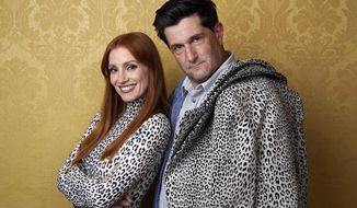 Jessica Chastain, left, the star of &amp;quot;The Eyes of Tammy Faye,&amp;quot; poses for a portrait with director Michael Showalter during the 2021 Toronto International Film Festival, Sunday, Sept. 12, 2012, at the Royal Fairmont York in Toronto. (AP Photo/Chris Pizzello)