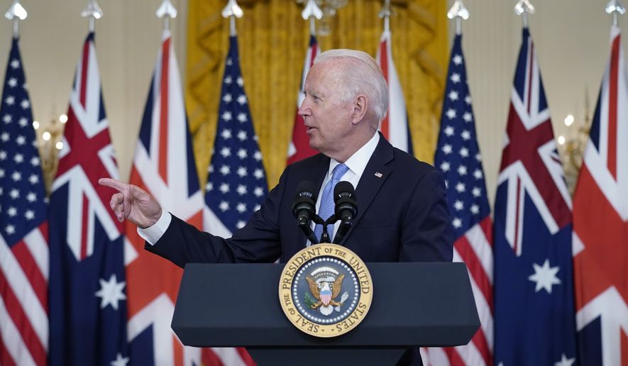 President Joe Biden, joined virtually by Australian Prime Minister Scott Morrison and British Prime Minister Boris Johnson, speaks about a national security initiative in the East Room of the White House in Washington, Wednesday, Sept. 15, 2021. (AP Photo/Andrew Harnik)