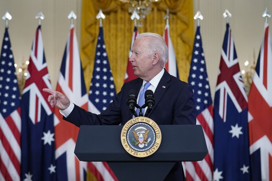 President Joe Biden, joined virtually by Australian Prime Minister Scott Morrison and British Prime Minister Boris Johnson, speaks about a national security initiative in the East Room of the White House in Washington, Wednesday, Sept. 15, 2021. (AP Photo/Andrew Harnik)