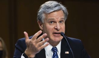 FBI Director Christopher Wray testifies during a Senate Judiciary hearing about the Inspector General&#39;s report on the FBI&#39;s handling of the Larry Nassar investigation on Capitol Hill, Wednesday, Sept. 15, 2021, in Washington. Nassar was charged in 2016 with federal child pornography offenses and sexual abuse charges in Michigan. He is now serving decades in prison after hundreds of girls and women said he sexually abused them under the guise of medical treatment when he worked for Michigan State and Indiana-based USA Gymnastics, which trains Olympians. (Graeme Jennings/Pool via AP)