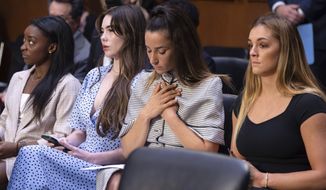 United States gymnasts from left, Simone Biles, McKayla Maroney, Aly Raisman and Maggie Nichols, arrive to testify during a Senate Judiciary hearing about the Inspector General&#39;s report on the FBI&#39;s handling of the Larry Nassar investigation on Capitol Hill, Wednesday, Sept. 15, 2021, in Washington. Nassar was charged in 2016 with federal child pornography offenses and sexual abuse charges in Michigan. He is now serving decades in prison after hundreds of girls and women said he sexually abused them under the guise of medical treatment when he worked for Michigan State and Indiana-based USA Gymnastics, which trains Olympians. (Saul Loeb/Pool via AP)