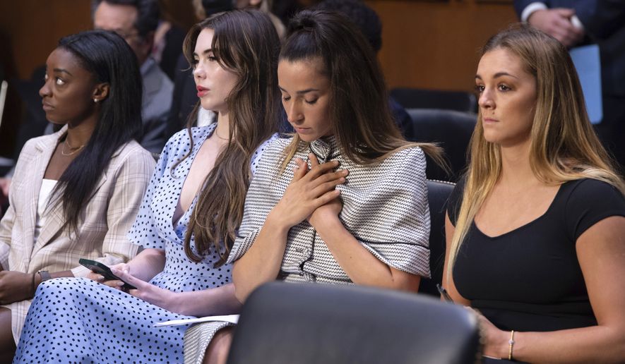 United States gymnasts from left, Simone Biles, McKayla Maroney, Aly Raisman and Maggie Nichols, arrive to testify during a Senate Judiciary hearing about the Inspector General&#x27;s report on the FBI&#x27;s handling of the Larry Nassar investigation on Capitol Hill, Wednesday, Sept. 15, 2021, in Washington. Nassar was charged in 2016 with federal child pornography offenses and sexual abuse charges in Michigan. He is now serving decades in prison after hundreds of girls and women said he sexually abused them under the guise of medical treatment when he worked for Michigan State and Indiana-based USA Gymnastics, which trains Olympians. (Saul Loeb/Pool via AP)