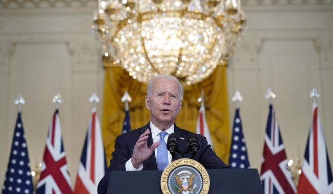 President Joe Biden, joined virtually by Australian Prime Minister Scott Morrison and British Prime Minister Boris Johnson, speaks about a national security initiative from the East Room of the White House in Washington, Wednesday, Sept. 15, 2021. (AP Photo/Andrew Harnik)