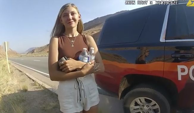 This police camera video provided by The Moab Police Department shows Gabrielle Gabby Petito talking to a police officer after police pulled over the van she was traveling in with her boyfriend, Brian Laundrie, near the entrance to Arches National Park on Aug. 12, 2021. The couple was pulled over while they were having an emotional fight. Petito was reported missing by her family a month later and is now the subject of a nationwide search. (The Moab Police Department via AP)