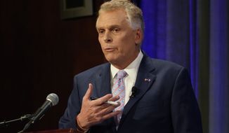 Democratic gubernatorial candidate and former governor Terry McAuliffe,  gestures during a debate at the Appalachian School of Law in Grundy, Va., Thursday, Sept. 16, 2021. (AP Photo/Steve Helber)