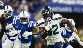 Seattle Seahawks running back Chris Carson (32) runs against the Indianapolis Colts in the first half of an NFL football game in Indianapolis, Sunday, Sept. 12, 2021. (AP Photo/Charlie Neibergall) **FILE**