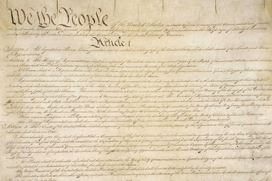 This photo made available by the U.S. National Archives shows a portion of the first page of the United States Constitution. (National Archives via AP) ** FILE **