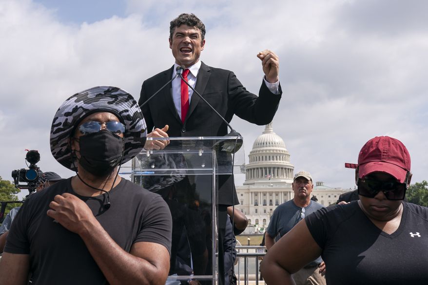 Joe Kent, a Republican primary candidate for Washington's 3rd Congressional's District, speaks during Justice For J6 rally, near the U.S. Capitol in Washington, Saturday, Sept. 18, 2021. The rally was planned by allies of former President Donald Trump and aimed at supporting the so-called "political prisoners" of the Jan. 6 storming of the U.S. Capitol. (AP Photo/Nathan Howard)