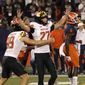 Maryland&#x27;s Joseph Petrino celebrates his game-winning field goal with holder Colton Spangler during the second half of the team&#x27;s NCAA college football game against Illinois on Friday, Sept. 17, 2021, in Champaign, Ill. Maryland won 20-17. (AP Photo/Charles Rex Arbogast)