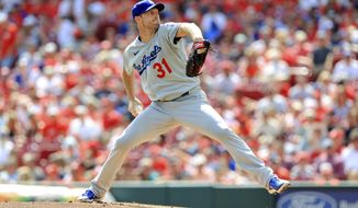 Los Angeles Dodgers&#39; Max Scherzer throws during the first inning of a baseball game against the Cincinnati Reds in Cincinnati, Saturday, Sept. 18, 2021. (AP Photo/Aaron Doster)