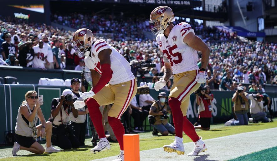 San Francisco 49ers wide receiver Jauan Jennings (15) celebrates a touchdown with teammate George Kittle (85) during the first half of an NFL football game against the Philadelphia Eagles on Sunday, Sept. 19, 2021, in Philadelphia. (AP Photo/Matt Rourke)