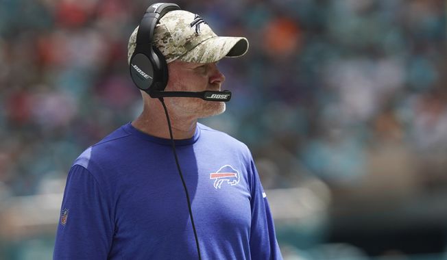 Buffalo Bills head coach Sean McDermott looks at the game during the first half of an NFL football game against the Miami Dolphins, Sunday, Sept. 19, 2021, in Miami Gardens, Fla. (AP Photo/Hans Deryk)