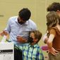 Liberal leader Justin Trudeau casts his ballot in the 44th general federal election as he&#39;s joined by his children, Xavier, Ella-Grace and Hadrien in Montreal on Monday, Sept. 20, 2021. (Sean Kilpatrick/The Canadian Press via AP)
