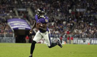 Baltimore Ravens quarterback Lamar Jackson rushes the ball in the second half of an NFL football game against the Kansas City Chiefs, Sunday, Sept. 19, 2021, in Baltimore. (AP Photo/Julio Cortez)