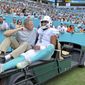 Miami Dolphins quarterback Tua Tagovailoa (1) carted out the field after getting injured in a play during the first quarter of an NFL football game against the Buffalo Bills at Hard Rock Stadium, Sunday, Sept. 19, 2021 in Miami Gardens, Fla. A battery of tests run on Tagovailoa failed to show any serious problems other than bruised ribs, raising at least the possibility that he could play next weekend when the Dolphins (1-1) visit the Las Vegas Raiders (2-0). (David Santiago/Miami Herald via AP) **FILE**