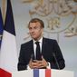 French President Emmanuel Macron delivers a speech during a meeting in memory of the Algerians who fought alongside French colonial forces in Algeria&#39;s war, known as Harkis, at the Elysee Palace in Paris, Thursday, Sept. 20, 2021. Macron&#39;s speech is the latest step in his efforts to reconcile France with its dark colonial past, especially in Algeria. (Gonzalo Fuentes/Pool Photo via AP)