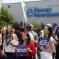 In this June 4, 2019, file photo, anti-abortion advocates gather outside the Planned Parenthood clinic in St. Louis. Pro-life activists are seeking to reinstate a lawsuit against the District claiming that police violated the free speech rights of two college students who were arrested for chalking &quot;Black Preborn Lives Matter&quot; on a sidewalk in front of Planned Parenthood in the summer of 2020. (AP Photo/Jeff Roberson, File)