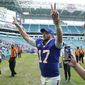 Buffalo Bills quarterback Josh Allen (17) raises his arms at the end of an NFL football game against the Miami Dolphins, Sunday, Sept. 19, 2021, in Miami Gardens, Fla. The Bills defeated the Dolphins 35-0. (AP Photo/Hans Deryk) **FILE**