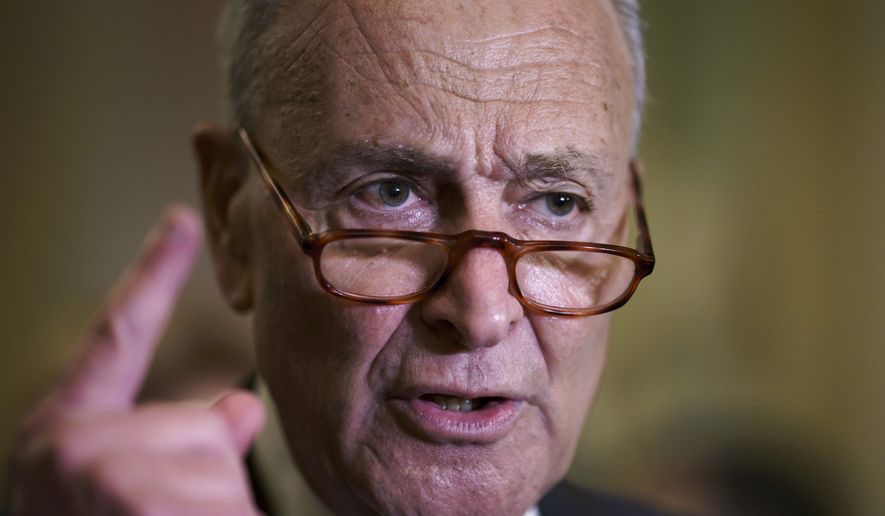 Senate Majority Leader Chuck Schumer, D-N.Y., criticizes Republicans as he speaks to reporters after a weekly policy meeting, at the Capitol in Washington, Tuesday, Sept. 21, 2021. (AP Photo/J. Scott Applewhite)