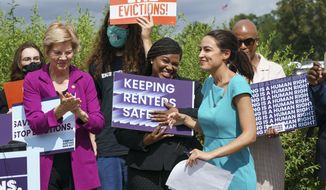 From left, Sen. Elizabeth Warren, D-Mass., Rep. Cori Bush, D-Mo., Rep. Alexandria Ocasio-Cortez, D-N.Y., and Rep. Ayanna Pressley, D-Mass., and other progressive lawmakers advocate for reimposing a nationwide eviction moratorium that lapsed last month, at the Capitol in Washington, Tuesday, Sept. 21, 2021. (AP Photo/J. Scott Applewhite)