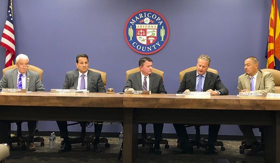 FILE - In this Oct. 23, 2019, file photo, the Maricopa County Board of Supervisors meets in Phoenix. Steve Chucri, second from left, a Republican official in Arizona resigned Tuesday, Sept. 21, 2021, from the board overseeing Maricopa County after a recording emerged of him criticizing his GOP colleagues for opposing a review of the 2020 election. (AP Photo/Jonathan J. Cooper, File)