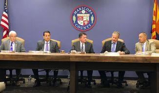 FILE - In this Oct. 23, 2019, file photo, the Maricopa County Board of Supervisors meets in Phoenix. Steve Chucri, second from left, a Republican official in Arizona resigned Tuesday, Sept. 21, 2021, from the board overseeing Maricopa County after a recording emerged of him criticizing his GOP colleagues for opposing a review of the 2020 election. (AP Photo/Jonathan J. Cooper, File)