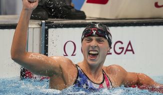 Katie Ledecky reacts after winning the women&#39;s 1500-meters freestyle final at the 2020 Summer Olympics in Tokyo, in this Wednesday, July 28, 2021, file photo. Ledecky announced Wednesday, Sept. 22, 2021, that she is moving to the University of Florida to be closer to home and train under Anthony Nesty, a rising star coach who will oversee her preparations for the 2024 Paris Olympics. Ledecky, a seven-time Olympic gold medalist, spent the last five years at Stanford University, where she worked with U.S. national team coach Greg Meehan while earning a psychology degree. (AP Photo/Matthias Schrader, File) **FILE**