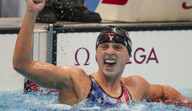 Katie Ledecky reacts after winning the women&#x27;s 1500-meters freestyle final at the 2020 Summer Olympics in Tokyo, in this Wednesday, July 28, 2021, file photo. Ledecky announced Wednesday, Sept. 22, 2021, that she is moving to the University of Florida to be closer to home and train under Anthony Nesty, a rising star coach who will oversee her preparations for the 2024 Paris Olympics. Ledecky, a seven-time Olympic gold medalist, spent the last five years at Stanford University, where she worked with U.S. national team coach Greg Meehan while earning a psychology degree. (AP Photo/Matthias Schrader, File) **FILE**